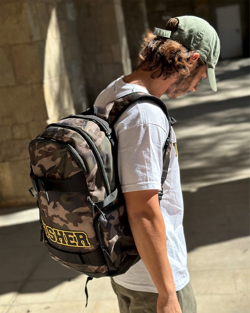 Explore the world with style - a man in a hat and backpack ready for adventure.